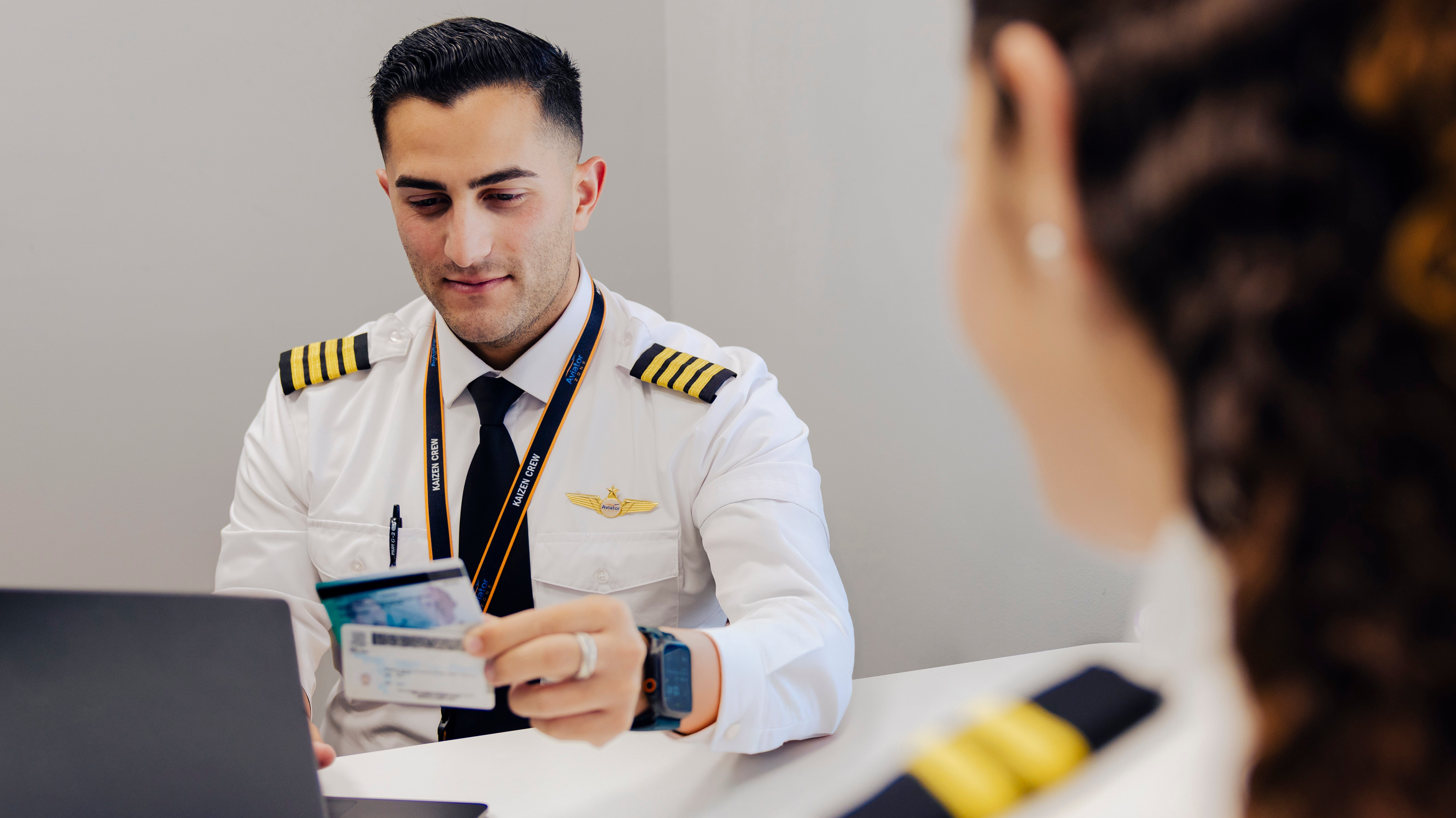 Instructor verifying student credentials.