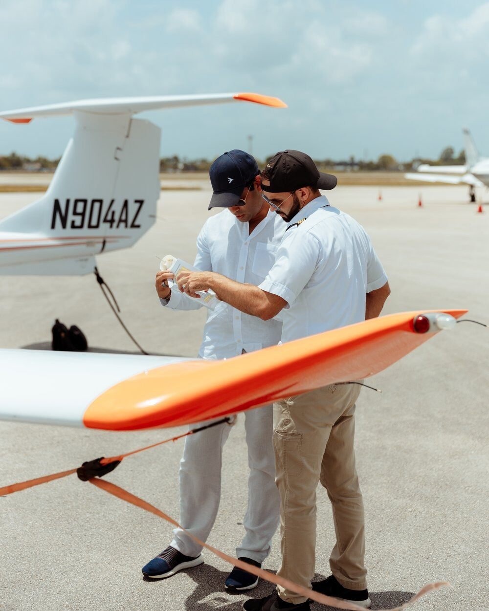 Student and flight instructor looking at flight records.