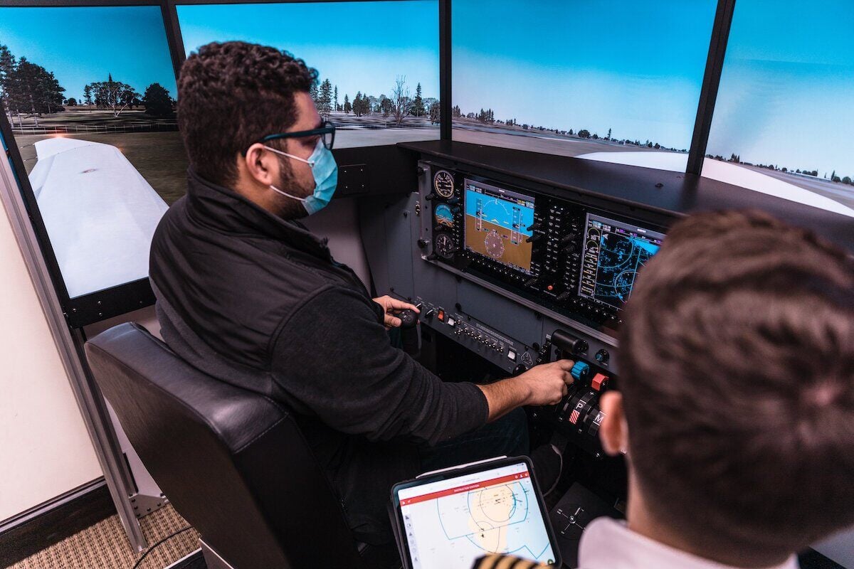 Student using flight simulator at Aviator Zone Academy