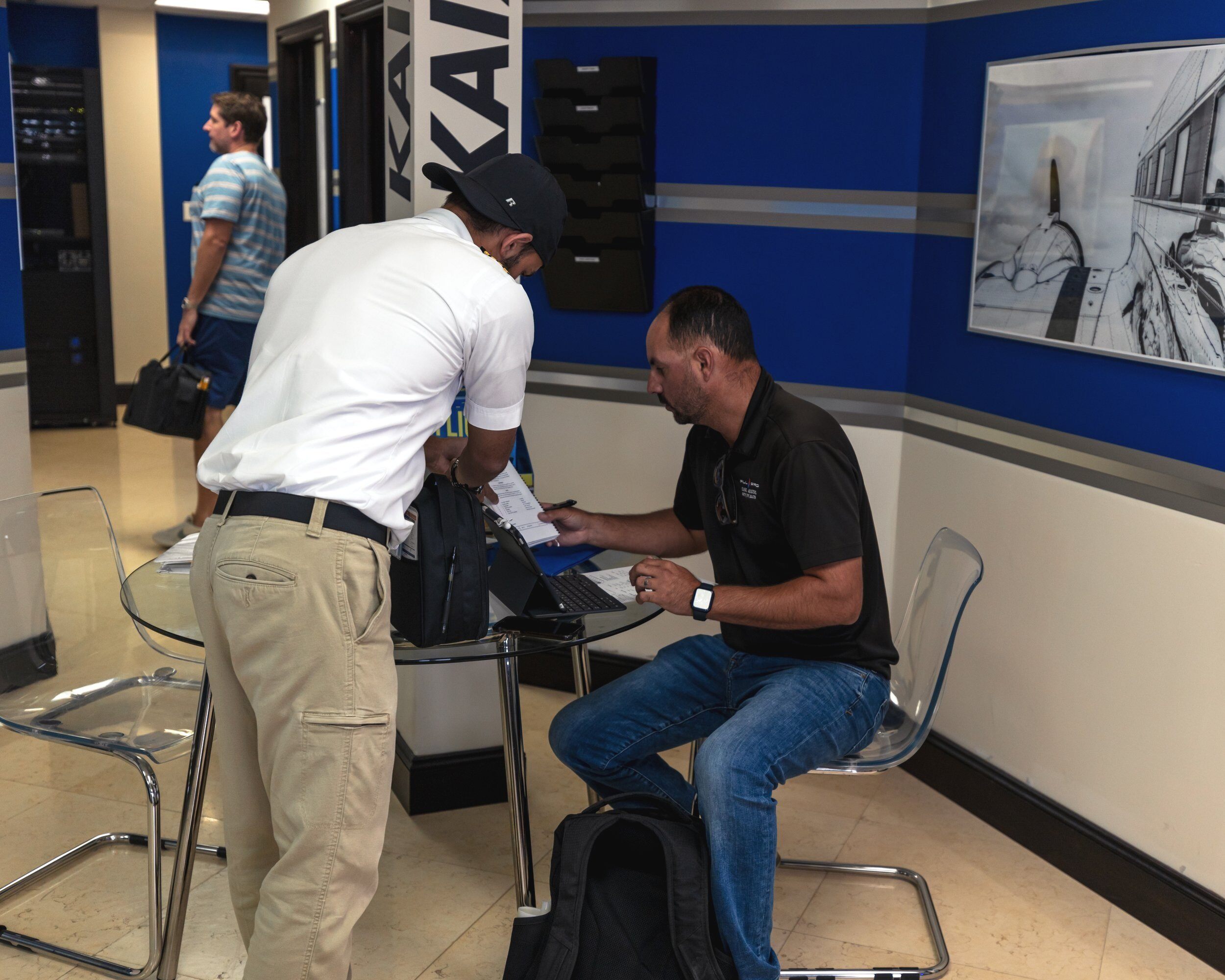 Photo of a student and flight instructor working together.