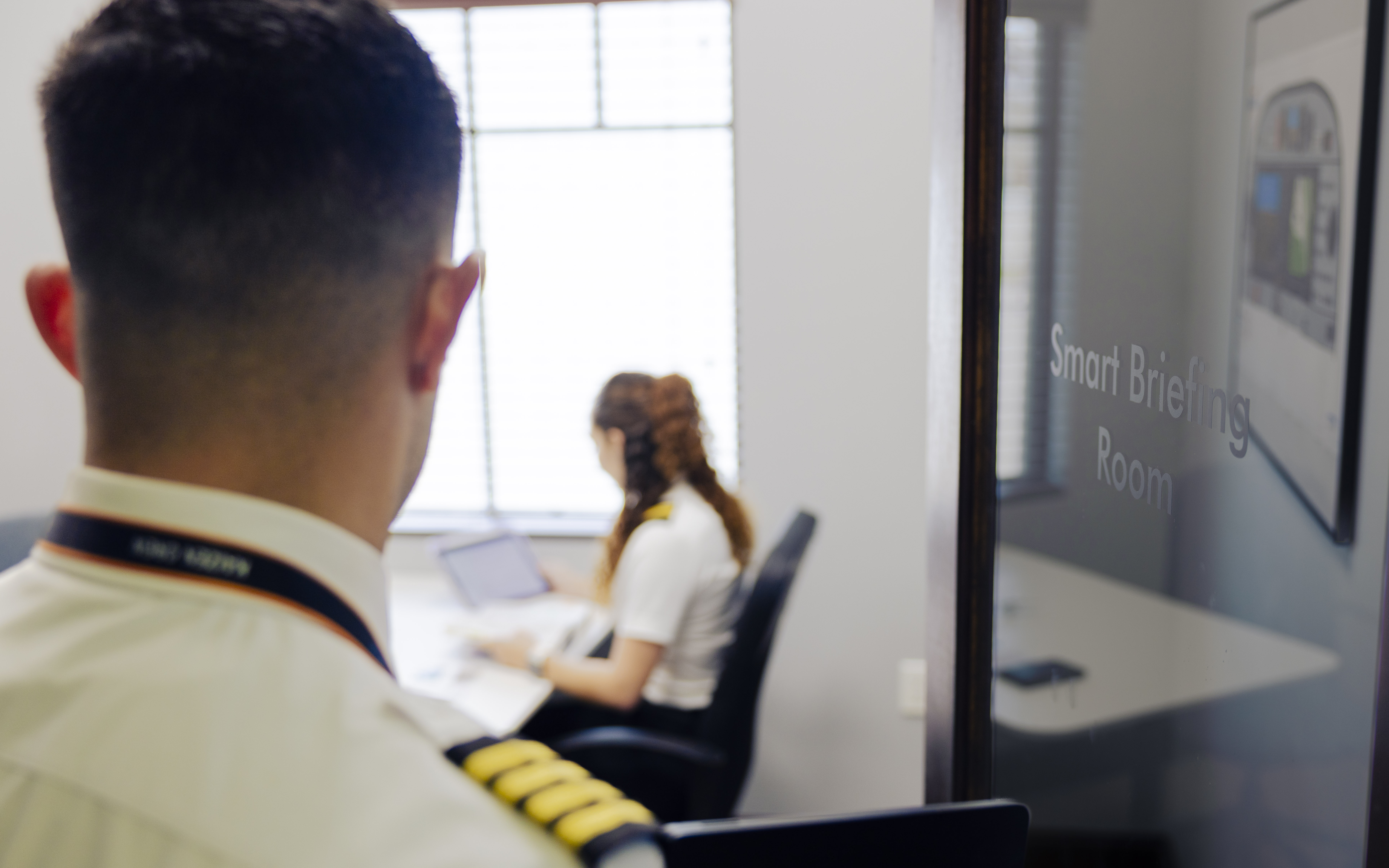 Instructor outside of a briefing room. 